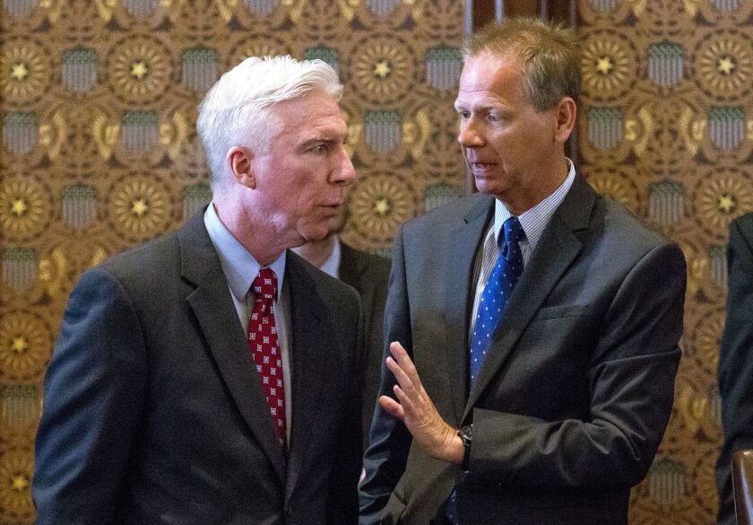 Sen. Dale Righter, R-Mattoon (right) talks with Sen. Michael Connelly, R-Naperville, on the Senate floor Tuesday at the Capitol in Springfield. | Rich Saal/The State Journal-Register, distributed by the Associated Press