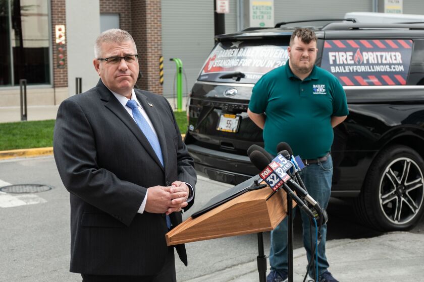 Republican Darren Bailey pauses while speaking to the media in the West Loop on Tuesday afternoon.