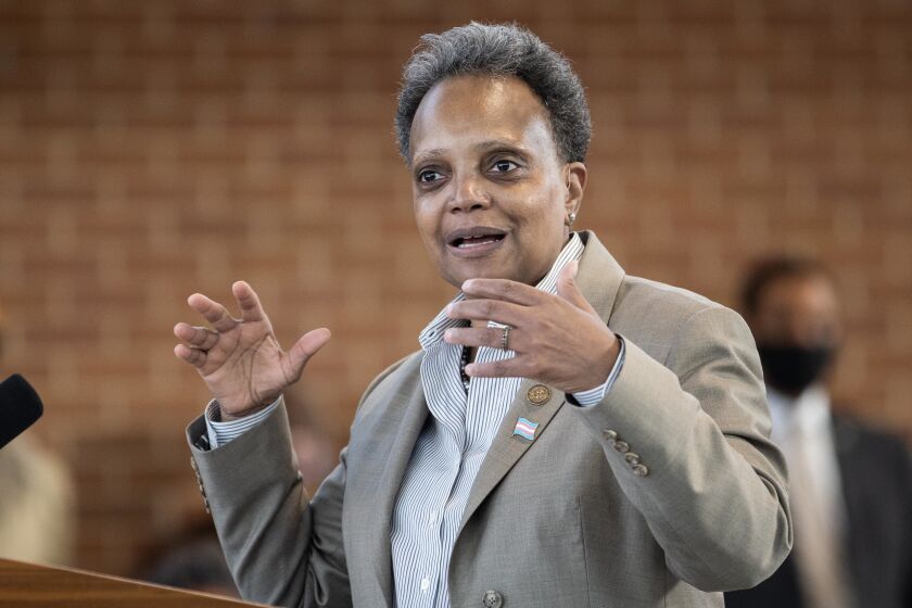 Chicago Mayor Lori Lightfoot speaks at a West Pullman neighborhood news conference Wednesday morning.