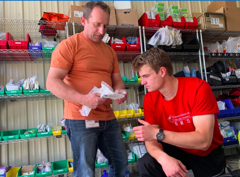 Glacier County EMS paramedic Robert Gordon (left) and EMT Camas Rinehart put together advanced life support bags for their ambulances. Glacier EMS is one of the few paid services along Montana’s Rocky Mountain Front that responds when volunteer agencies can’t and provides advanced life support transfers from critical access hospitals to larger facilities miles away.