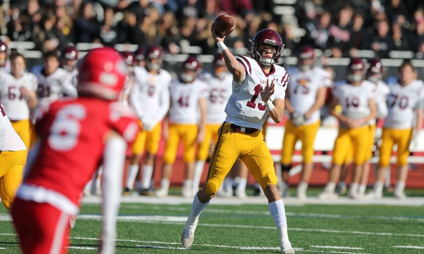 Loyola’s Jake Stearney (15) throws a pass as the Ramblers play Naperville Central.