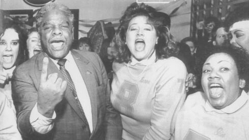 Mayor Harold Washington chants with "the Refrigerettes," a cheer squad celebrating famed Super Bowl-era Bears player William "the Refrigerator" Perry.
