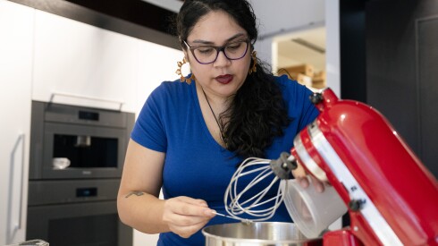 Author Mia P. Manansala makes mocha “mamon” at the Miele Experience Center Chicago at Merchandise Mart in River North, Wednesday, Nov. 12, 2025. | Pat Nabong/Sun-Times