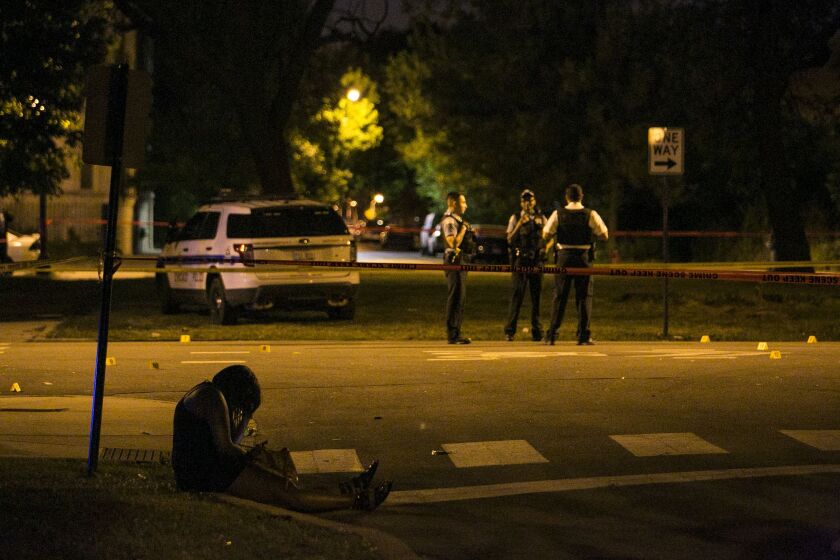 Chicago Police investigate at Douglas and Christiana, where eight people were shot early Sunday, June 11, 2017. | Ashlee Rezin/Sun-Times