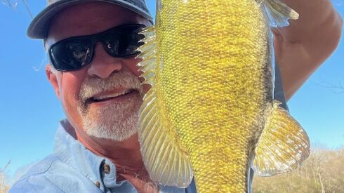 Dave Starshak with a ood smallmouth bass from the Kankakee River in the Kankakee River State Park. Provided photo