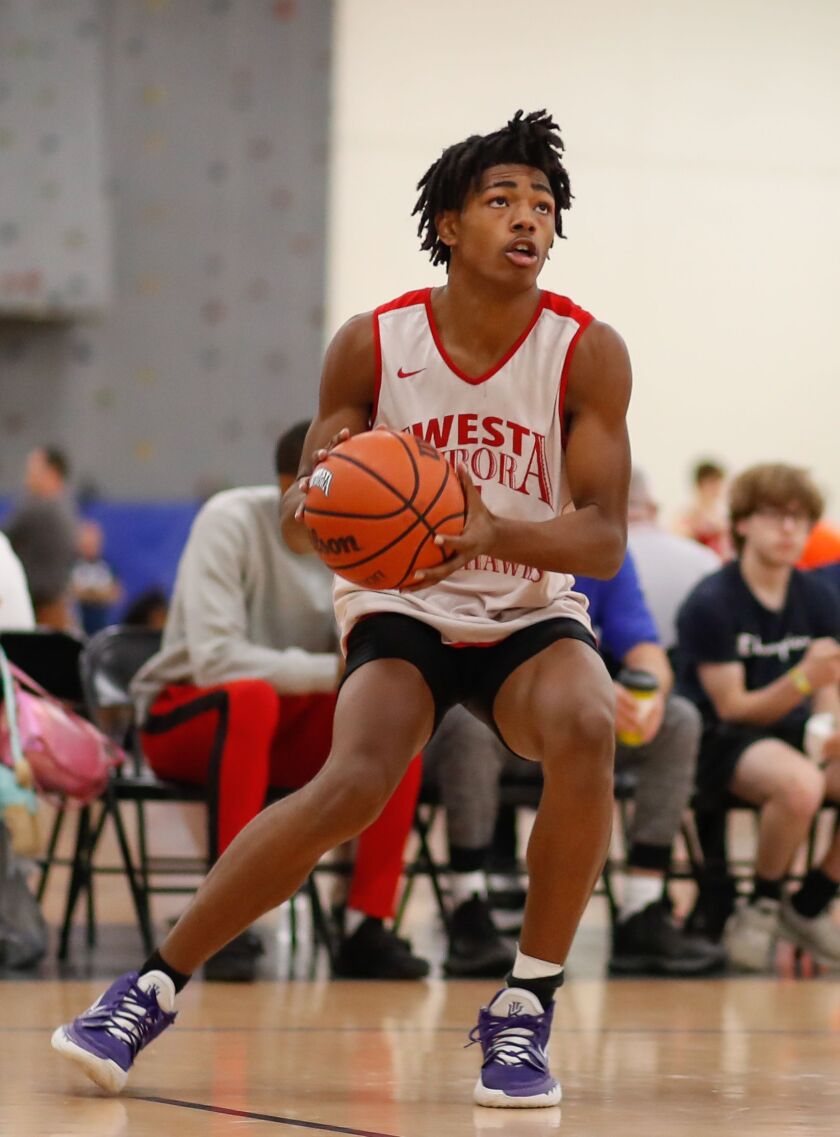 West Aurora’s Terrence Smith (5) prepares to shoot the ball against Joliet West during the Riverside-Brookfield Shootout.