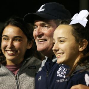 Lisle’s coach Paul Parpet enjoys the Lions 23-20 victory over the Streator Bulldogs.| Allen Cunningham / for Chicago Sun-Times