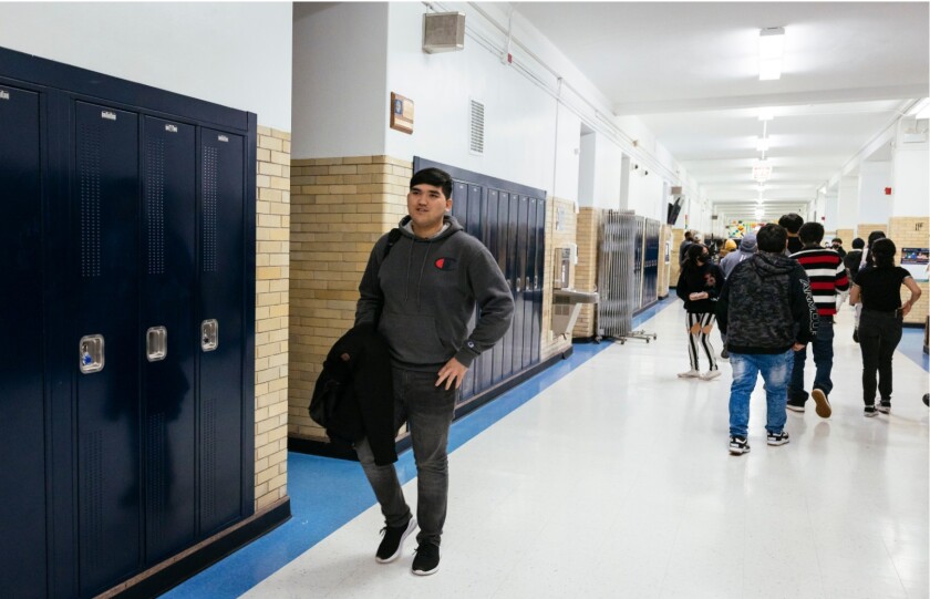 Aziz in the hallways at Sullivan High School in Roger Park between classes.