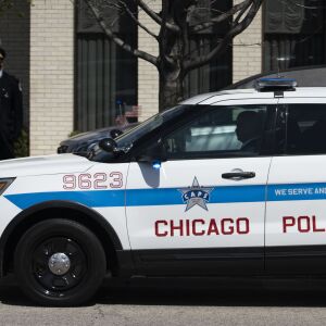 Hundreds of law enforcement officers sit in their vehicles along West Lawrence Avenue, as only family members were permitted inside Cumberland Funeral Chapels for Chicago Police Officer Marco DiFranco, Thursday, April 9, 2020.