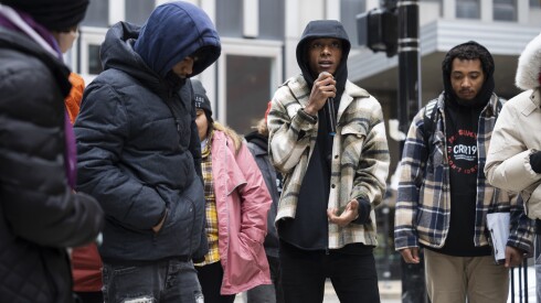 Jacob Tate, one of the artists with Firebird Community Arts who helped create glass markers that commemorate the lives lost during the 1919 race riots, speaks during a walking tour organized by the Chicago Race Riot of 1919 Commemoration Project at the intersection of Adams and Wabash in the Loop, Saturday, Nov. 8, 2025.