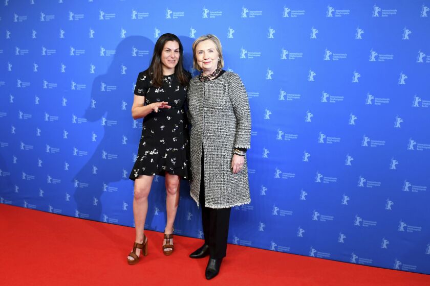 Hillary Clinton and director Nanette Burstein pose for the photographers during photo-call for the film ‘Hillary’ at at the 70th International Film Festival Berlin, Berlinale in Berlin, Germany, in February.