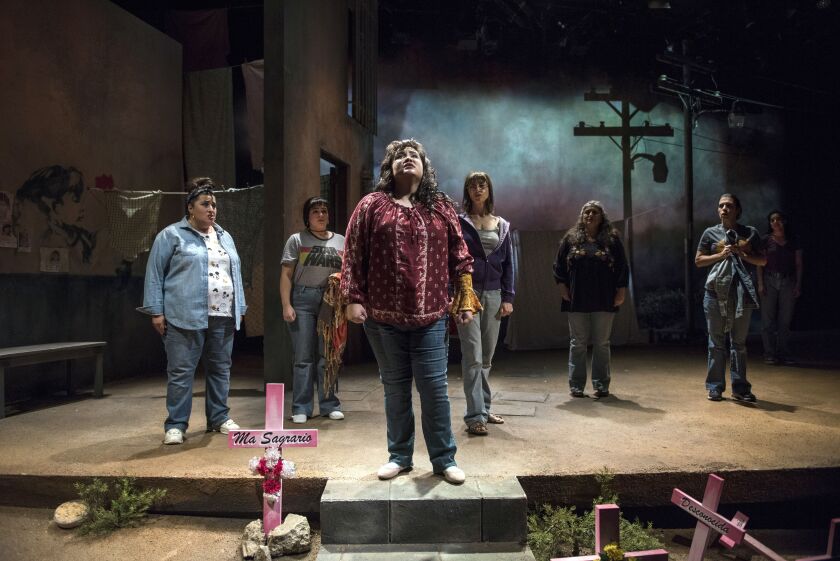 Karen Rodriguez (center, front) stars as Yvonne in “La Ruta,” directed by Sandra Marquez in the Steppenwolf Upstairs Theatre. | Michael Brosilow