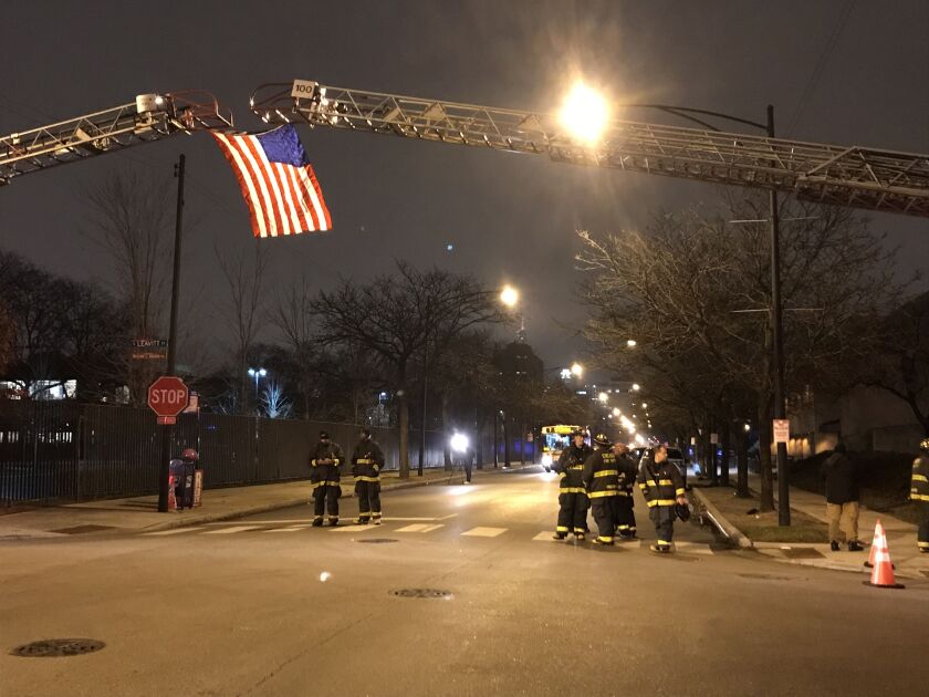First responders prepare for police officer Samuel Jimenez’s body to arrive at the Cook County medical examiner’s office. | Tyler LaRiviere/Chicago Sun-Times