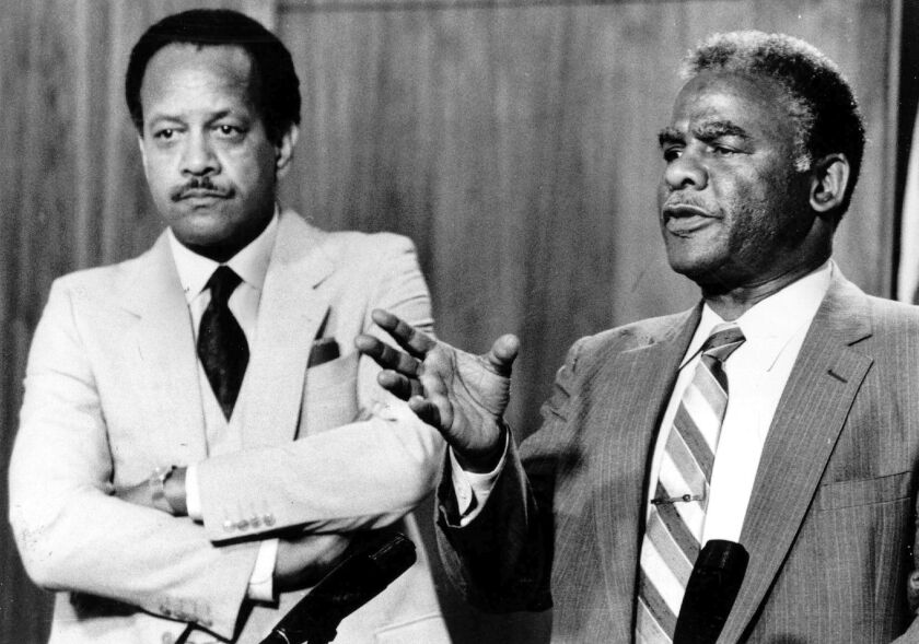 Mayor Harold Washington holds a news conference with then acting City Corporation Counsel James Montgomery in 1983. File Photo.