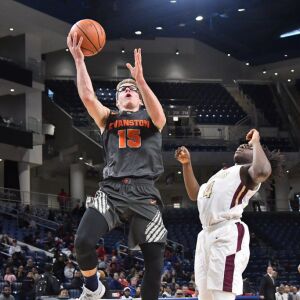 Evanston’s Blake Peters (15) blows past Uplift’s Taijay Brown (4). Worsom Robinson/For the Sun-Times.