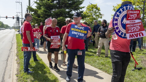 About a hundred United Auto Workers union members rally outside Woodward Inc. on Tuesday, June 29, 2026.