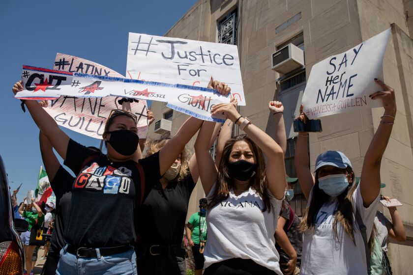 Dozens of community members, veterans and service members gather near the Illinois National Guard’s Recruiting Office at 1551 N. Kedzie Ave. on July 3, 2020 to demand justice for Pfc. Vanessa Guillen, who was killed at Fort Hood in Texas.