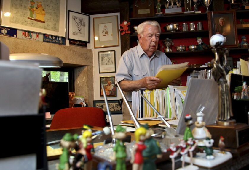 In this Aug. 16, 2010 file photo, Mort Walker, the artist and author of the “Beetle Bailey” comic strip, looks over notes and documents in his studio in Stamford, Conn. Walker passed away Jan. 27 at the age of 94. | AP Photo/Craig Ruttle