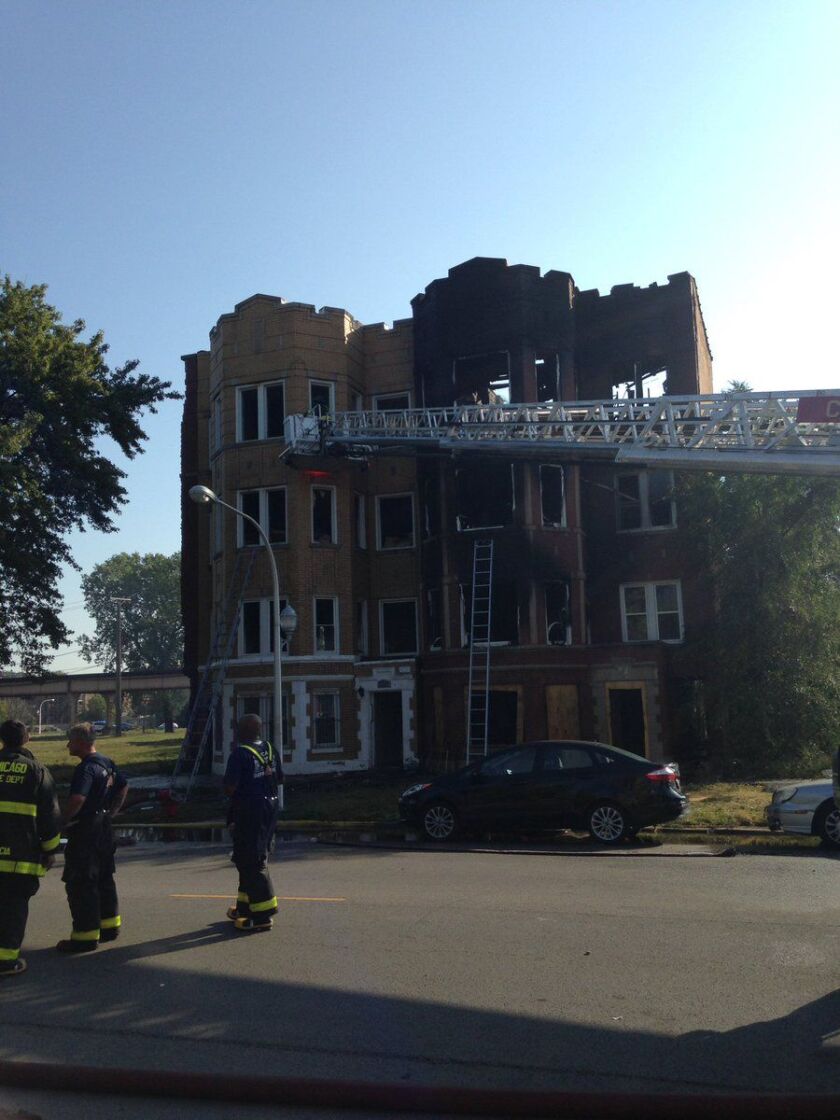 A two-alarm fire damaged two buildings and displaced multiple residents Saturday morning in Washington Park. | Fire Media Affairs