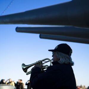 Bugler Nan LaCorte plays taps during a Pearl Harbor ceremony in Camden, N.J. | AP Photo