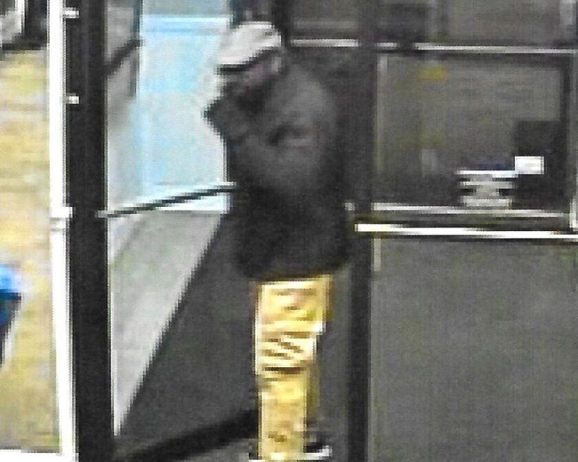 The FBI released video frames of a man suspected of robbing two banks in Hyde Park in December. | FBI