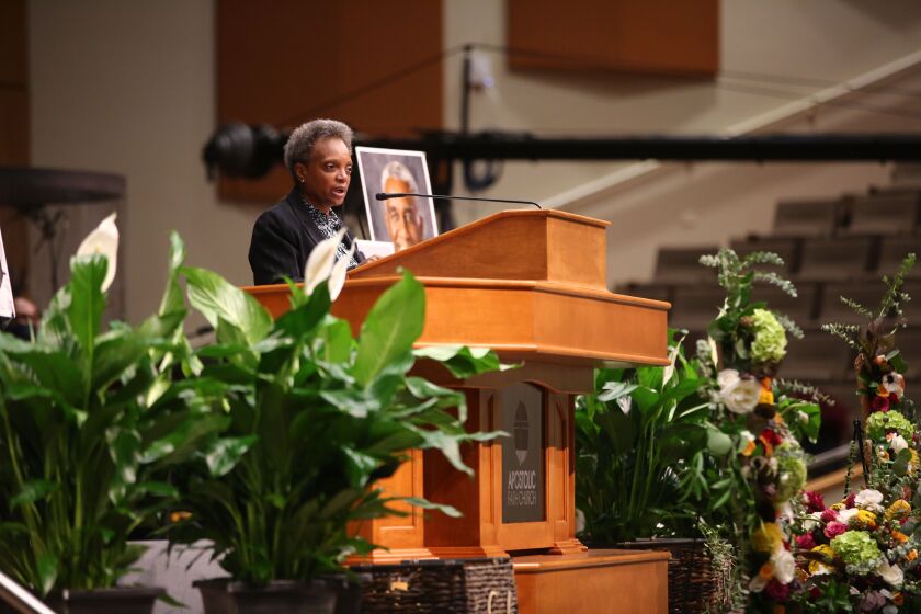 Mayor Lori Lightfoot speaks Saturday at the visitation and funeral service for Dr. Leon Finney Jr. at Apostolic Faith Church in Bronzeville.