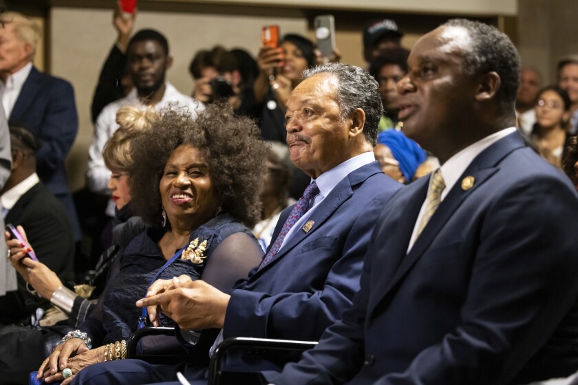 Flanked by family members, Rev. Jesse Jackson listens as speakers wish him a happy 83rd birthday during a celebration at City Hall, Tuesday, Oct. 8, 2024. | Ashlee Rezin/Sun-Times