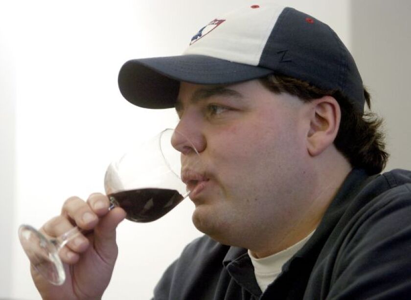<br>Tom Moro tries out a Tony Esposito-signature cabernet during a wine-tasting hosted by the Chicago Sun-Times in 2008. | Sun-Times file photo