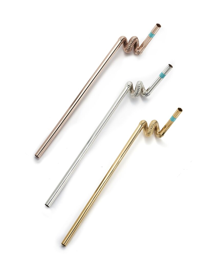 Tiffany’s selection of non-paper straws include sterling silver covered in rose gold vermeil (top). The “crazy straw” style features a twist at the bend at the top and a tiny band of the Tiffany blue in enamel, just to make sure people know its origins. |