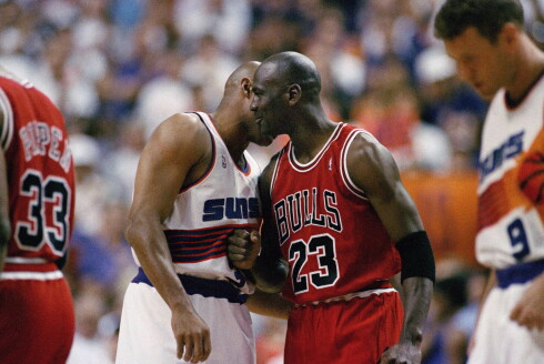 The Bulls' Michael Jordan speaks to the Phoenix Suns Charles Barkley during Game 6 of the NBA Finals in Phoenix on June 20, 1993.