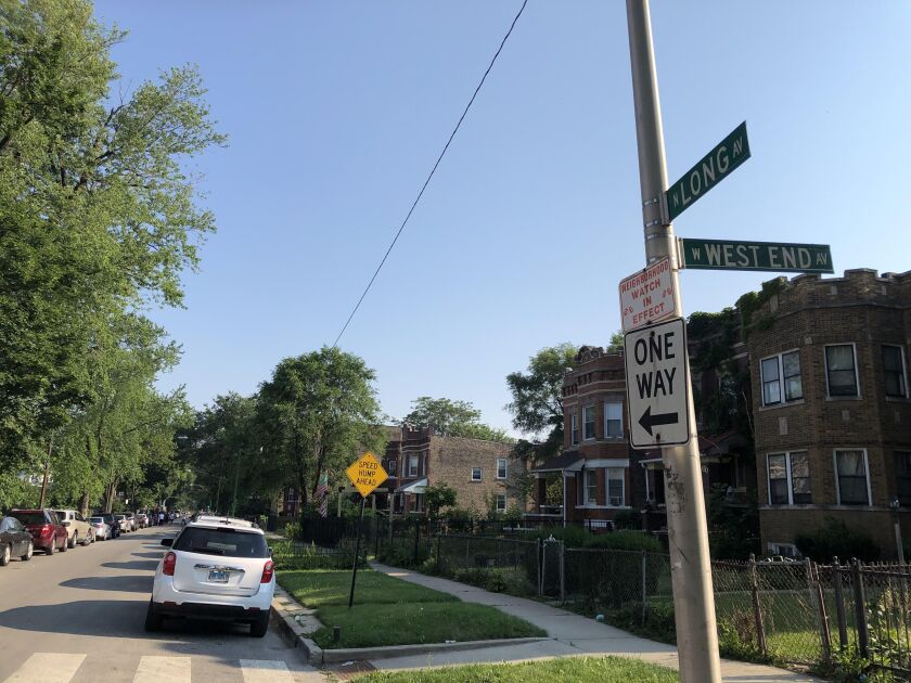 A street sign marks the 100 block of North Long Avenue, where police Cmdr. Patrina Wines and another officer were shot after police dispersed a crowd gathered for a Fourth of July block party. Wines was struck in the foot as she talked with neighborhood residents. 