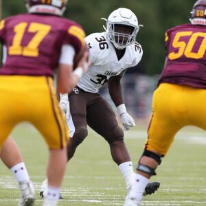 Mount Carmel’s Kennena Odeluga (36) keeps his eyes on the quarterback. Allen Cunningham/For the Sun-Times.