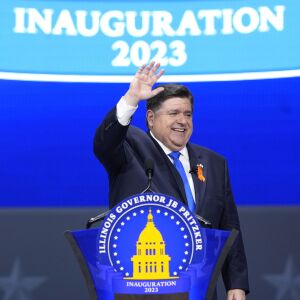 Illinois Gov. J.B. Pritzker waves to crowd after delivering his inaugural address during ceremonies Monday, Jan. 9, 2023, in Springfield, Ill.