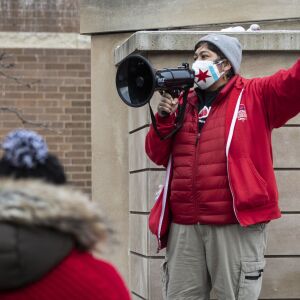Tracy Barrientos, a seventh grade science teacher at Math and Science Academy, rallies Chicago Teachers Union members and their supporters in Pilsen during a protest to call for “safety, equity and trust in any school reopening plan” on Martin Luther King Jr. Day, Monday morning, Jan. 18, 2021.