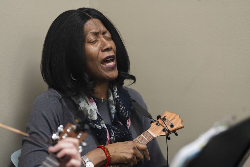 Linda Robinson performs a solo during The Hix Bros Ukulele Band rehearsal at Musical Expressions in Naperville, Saturday, Jan. 27, 2024.