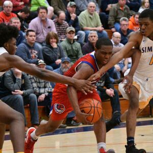 Simeon’s Sincere Callwood (4) and Simeon’s Jaylen Drane (1) trie to steal the ball away from Curie’s Trevon Hamilton (5), Saturday 12-29-18. Worsom Robinson/For Sun-Times