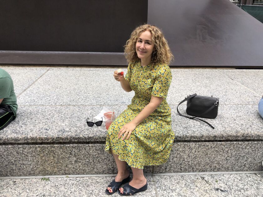 Joanna Rakoff enjoys a cupcake in Daley Plaza on Friday
