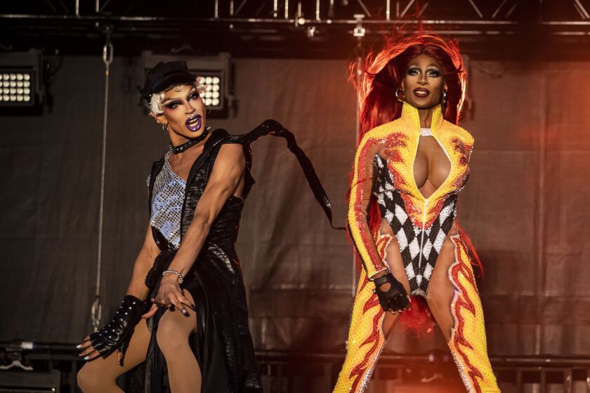 Yvie Oddly (left) and Jaida Essence Hall perform together during Drive ‘N Drag presented by Voss Events at Soldier Field, Friday night, Aug. 7, 2020.