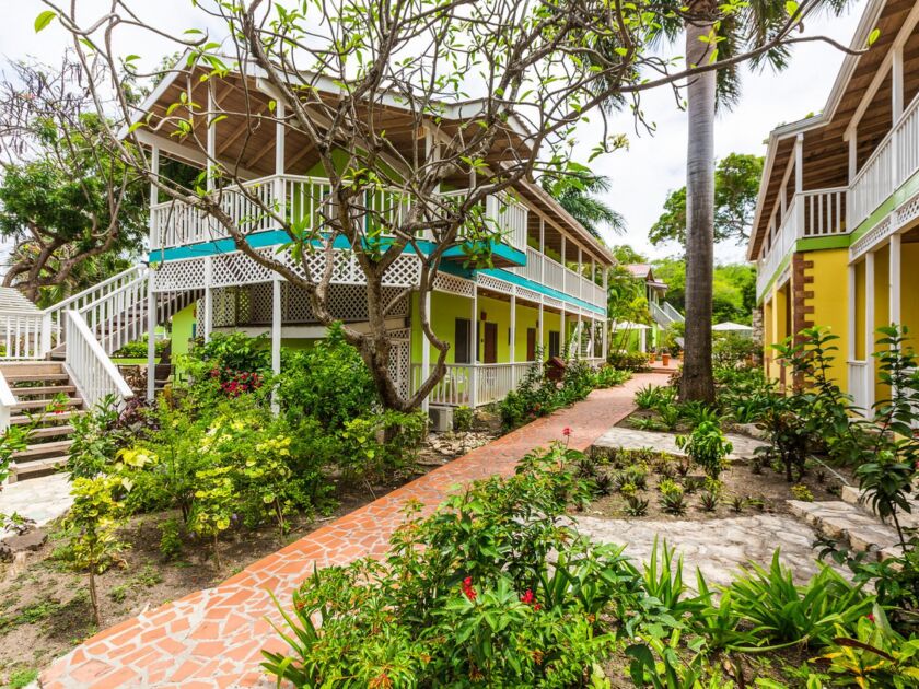 On 30 acres overlooking Long Bay on the Caribbean coast, the adults-only all-inclusive Elite Island resort is adjacent to the Devil’s Bridge National Park and the Verandah Resort. | Elite Island Resorts