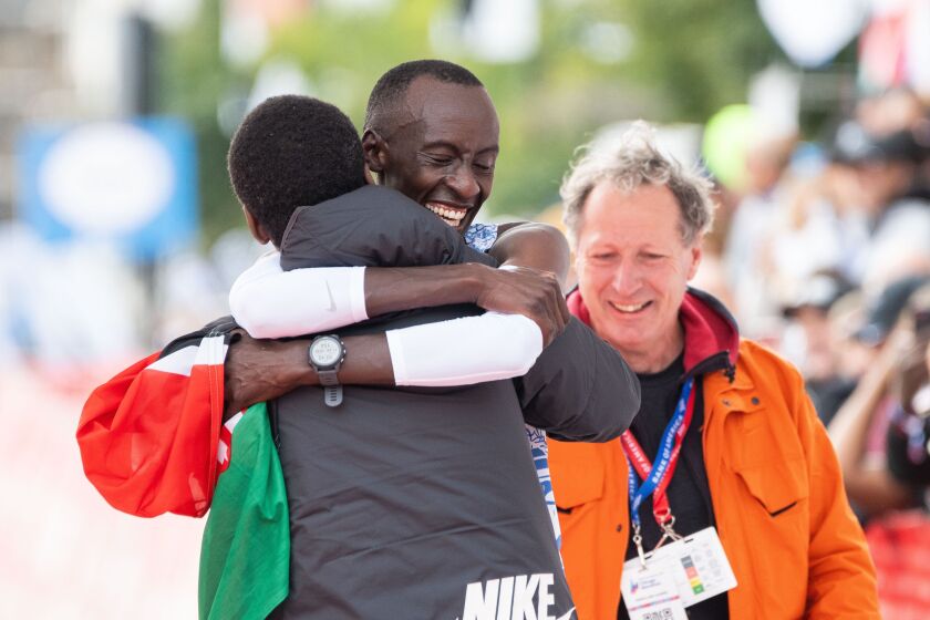 Kelvin Kiptum from Kenya, who set a new world record, celebrates after crossing the finish line of the Bank of America Chicago Marathon at Grant Park, Sunday, Oct. 8, 2023. | Pat Nabong/Sun-Times