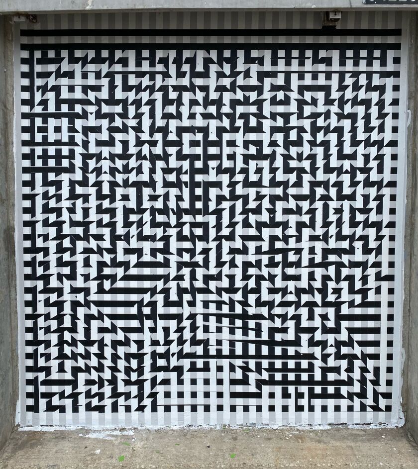 Daniel Shoykhet’s mural “KVTNO9” at Hubbard Street and Milwaukee Avenue stands for “Kinetic Visual Test Number 9.” It’s the ninth installment in a series. He says he hopes to do at least 60 more works in the same series.