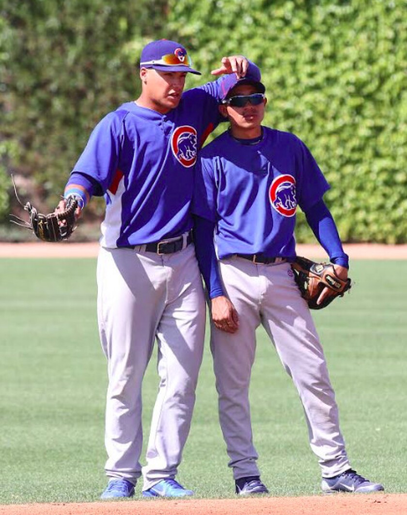 <em>The 5-8 Torres with Baez during spring 2013 (John Antonoff photo)</em>