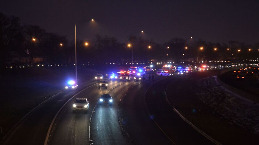 Police investigate a shooting Tuesday night on Interstate 57 near 101st Street. | Justin Jackson/ Sun-Times