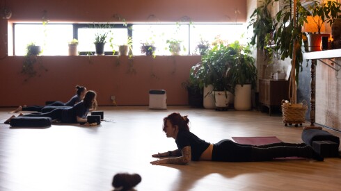 Teacher Lauren Oberlin (right) leads class at Wildlight Yoga’s Mindful Market in the Portage Park neighborhood on the Northwest Side, Saturday, Nov. 29, 2025.