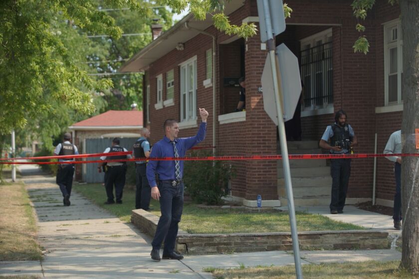 Police investigate Saturday after a boy was killed in the South Chicago neighborhood.