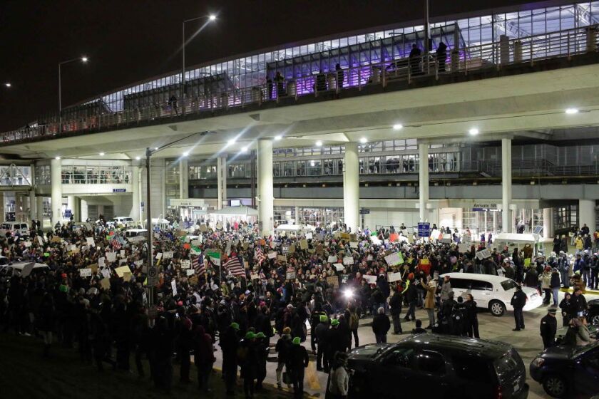 Demonstrators protest agaist President Trump’s executive immigration ban at Chicago O’Hare International Airport on January 28. | Joshua Lott/AFP/Getty Images