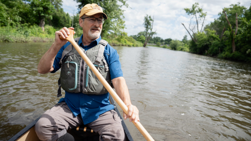Freelance reporter Zachary Nauth paddles a canoe on the DuPage River during a trip starting at the Warrenville Grove Forest Preserve boat launch in Warrenville, Ill. to McDowell Grove Forest Preserve in Naperville, Ill., Tuesday, June 16, 2026.