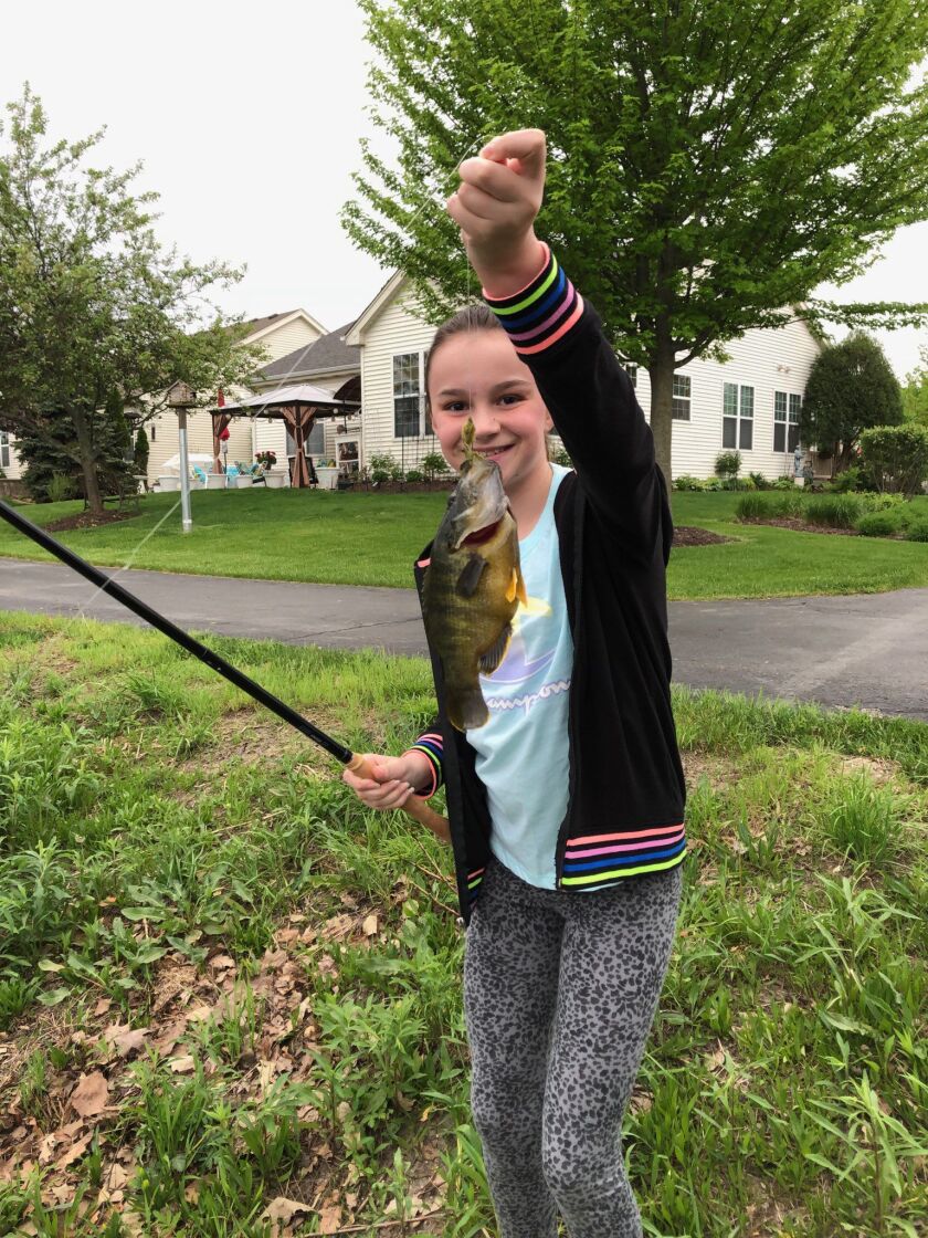 Pete Lamar’s daughter with what appears to be a hybrid bluegill, caught with a Tenkara rod. Provided photo