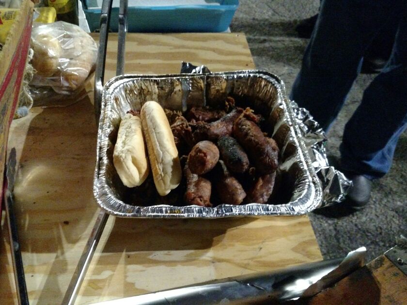 Sausages grilled near Shedd Aquarium on opening night in 2019 of smelt netting on the Chicago lakefront. Credit: Dale Bowman
