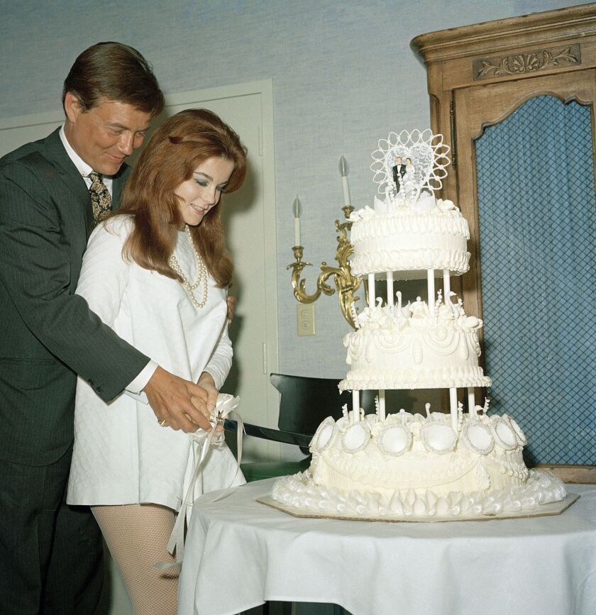 Roger Smith and Ann-Margret cut the cake on their wedding day in Las Vegas i 1967. | AP File
